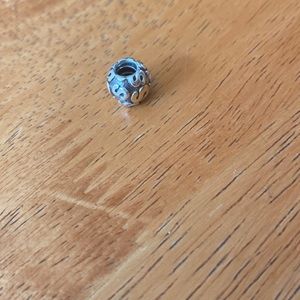 Gold and silver letter “S” charm